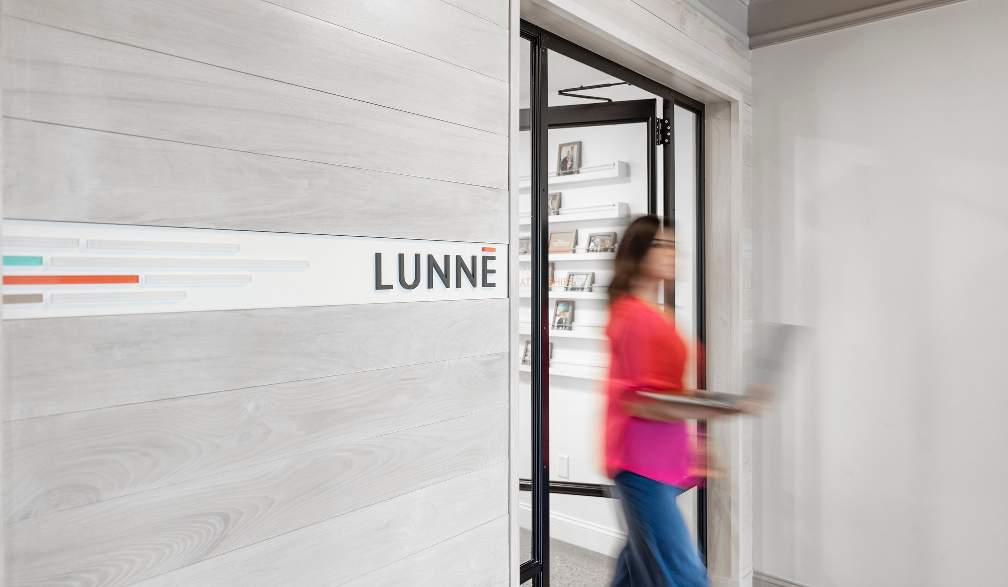 Team member walking through Lunne door at Columbus office