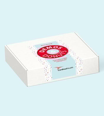 A closed box bearing the design and logo of a donut shop