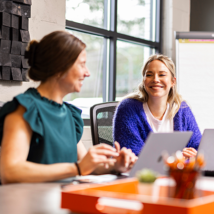 Life-at-Lunne-Charlotte-two-women-talking-in-conference-room